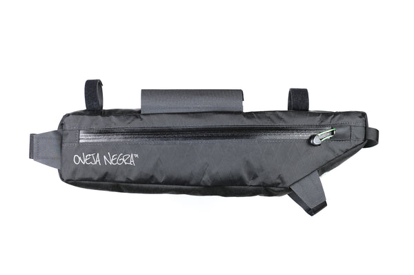Oveja Negra's partial frame bike bag, the 1/2 Pack™, allows for gear storage within your triangle while leaving room to run water bottles/cages. 